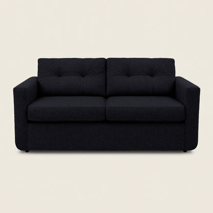 Black sofa on a beige background