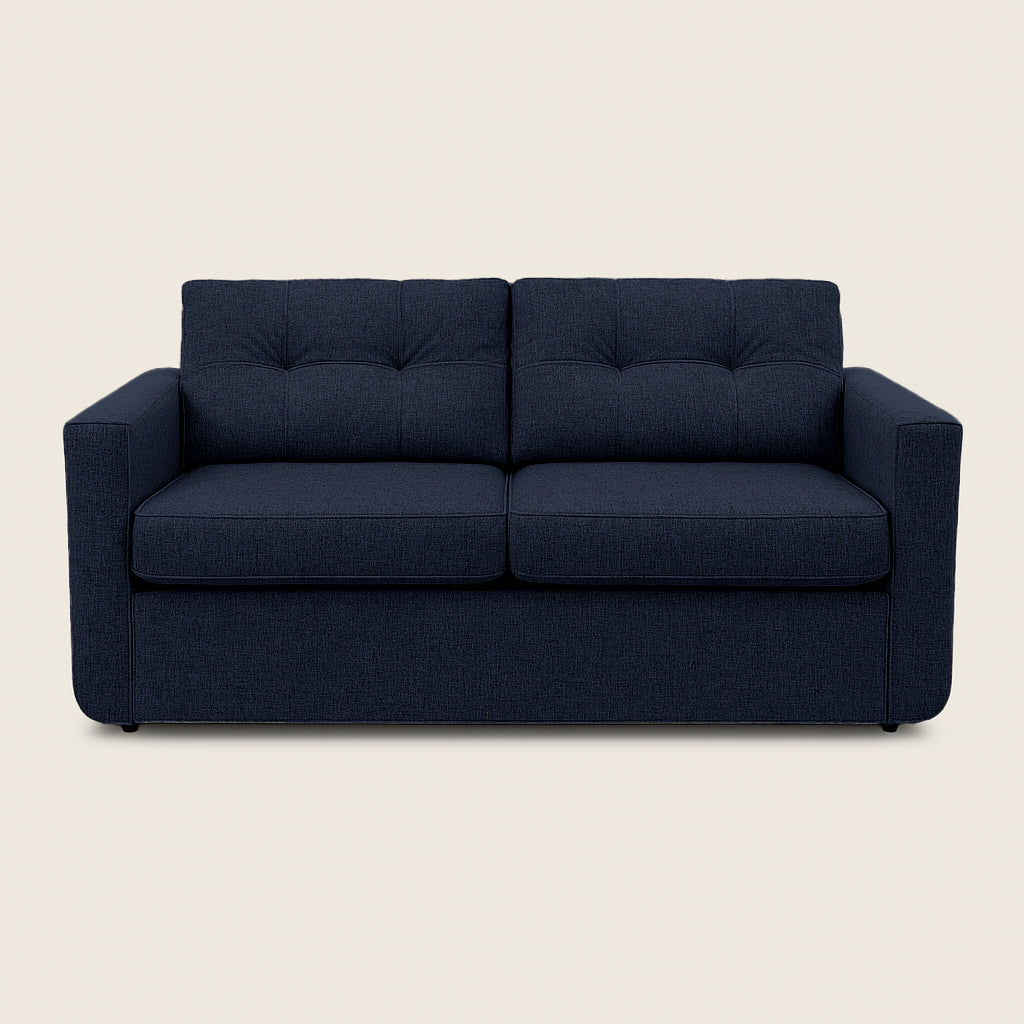Navy blue sofa on a beige background