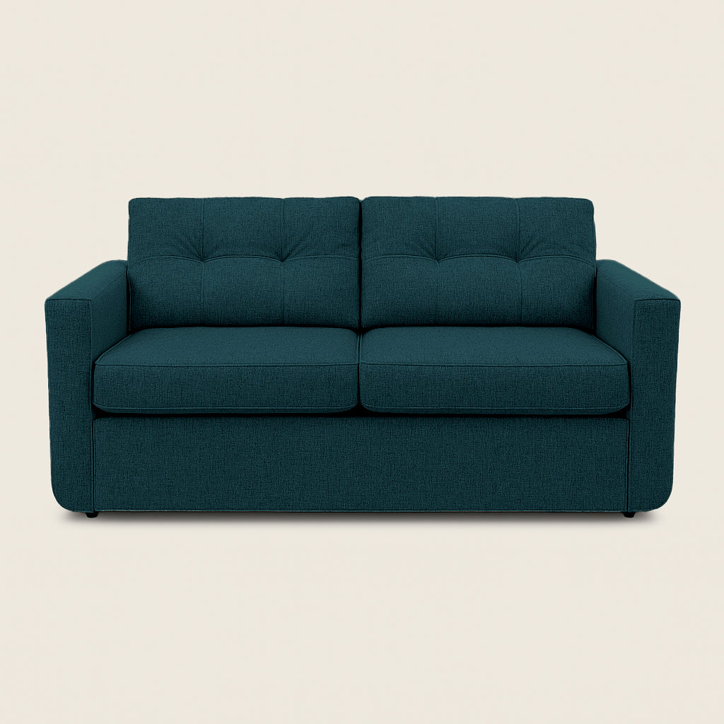 Teal sofa on a beige background