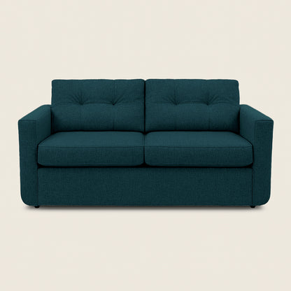 Teal sofa on a beige background