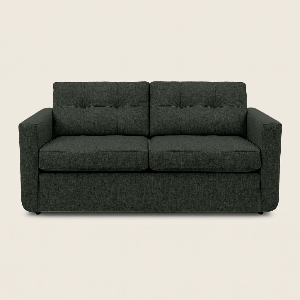 Dark gray sofa on a beige background