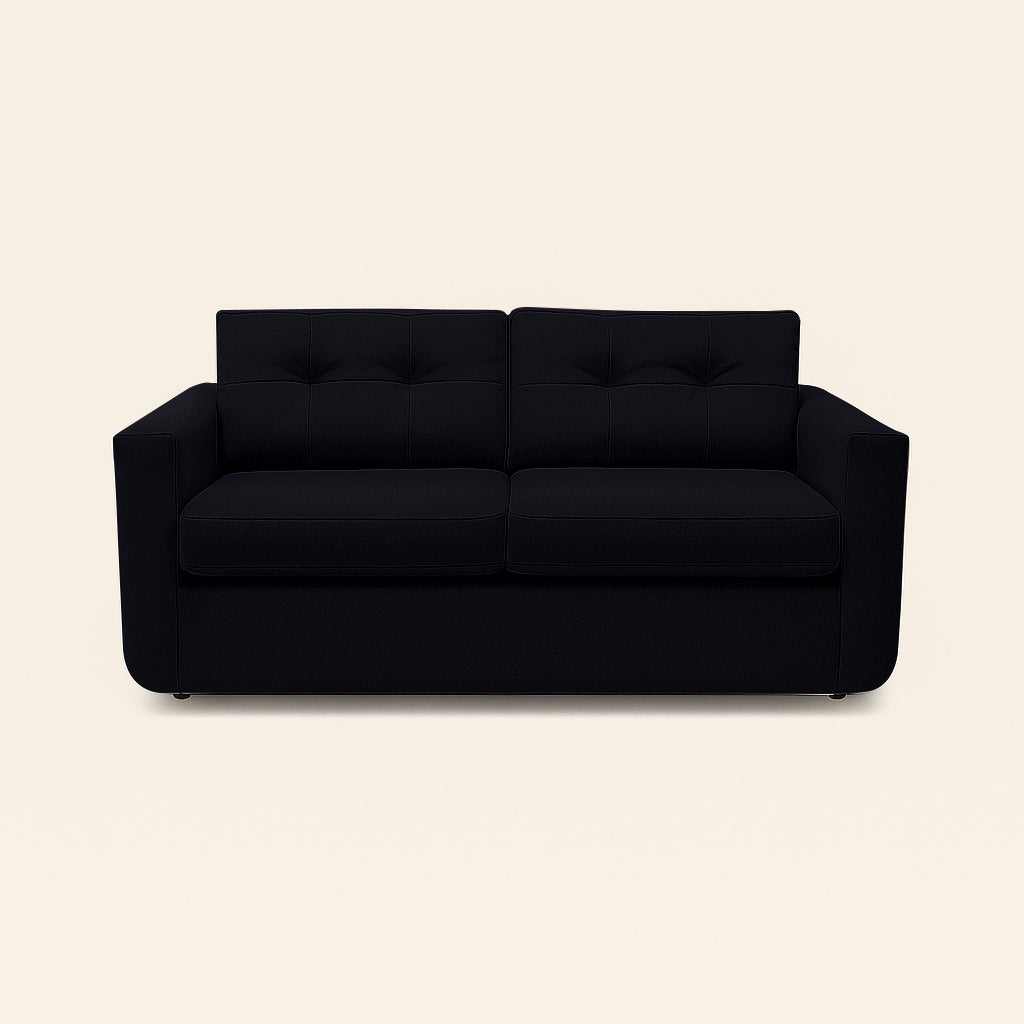 Black sofa on a beige background
