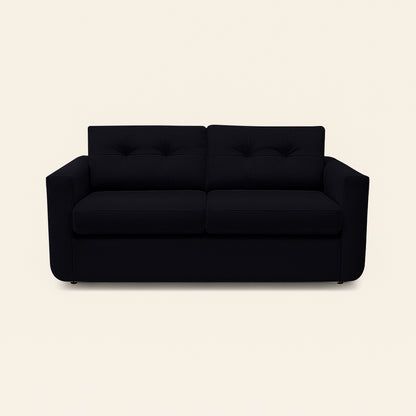 Black sofa on a beige background