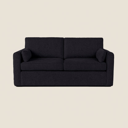 Black sofa on a beige background