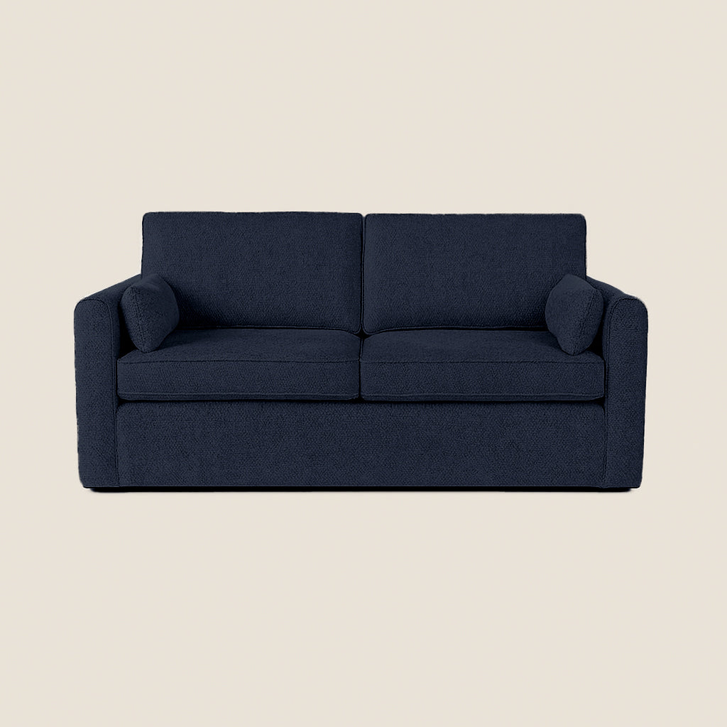 Navy blue sofa on a beige background