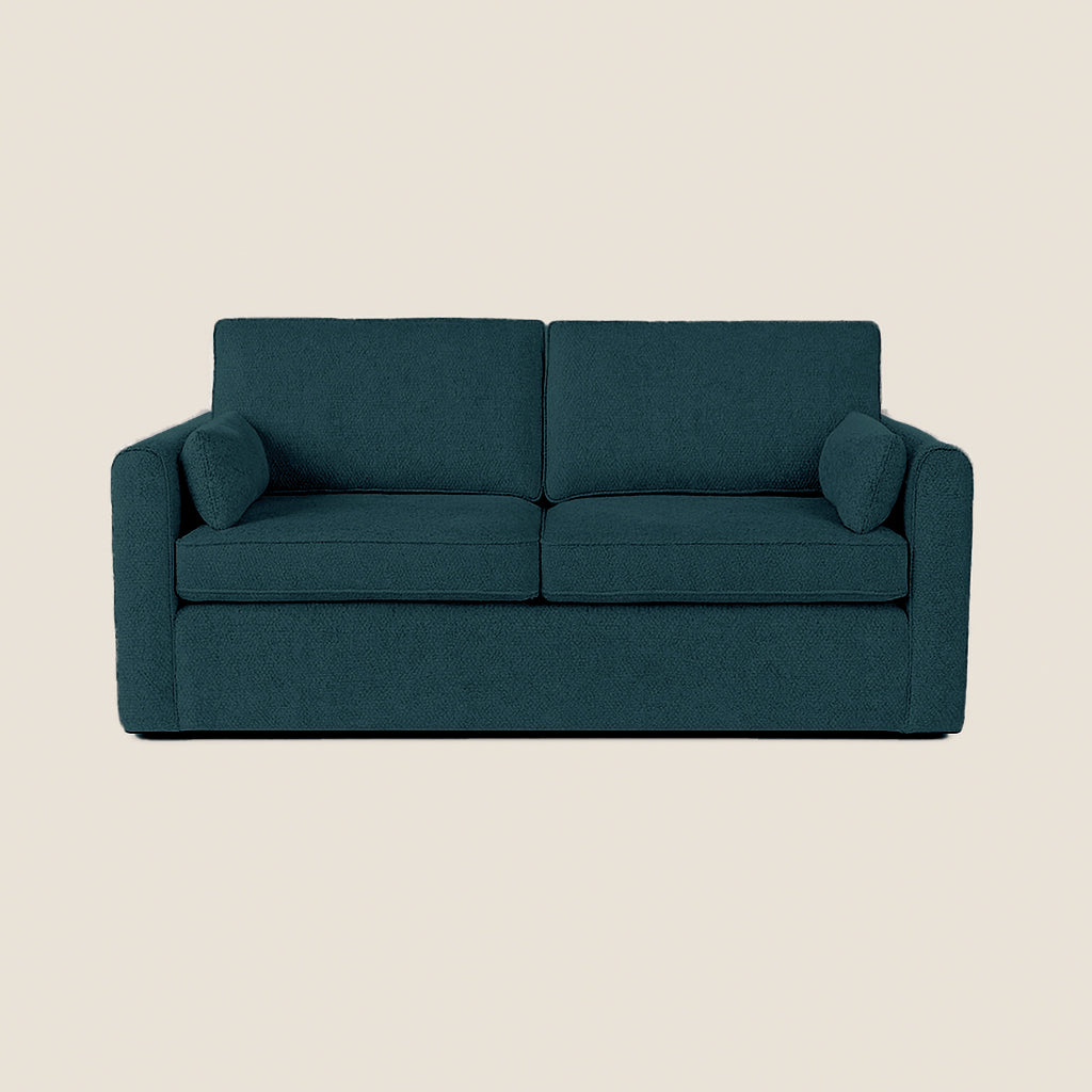 Teal sofa on a beige background