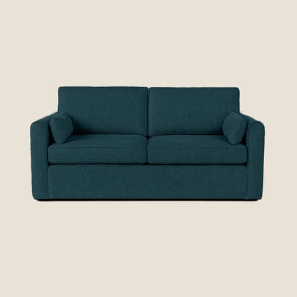 Teal sofa on a beige background