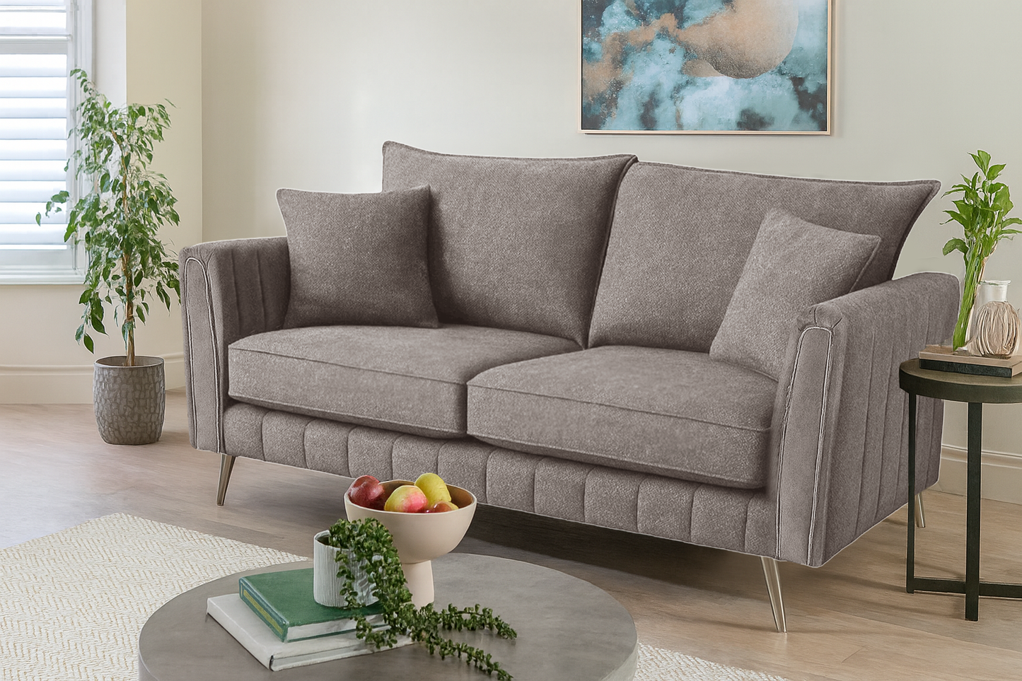 Gray sofa in a living room with decorative items and plants.