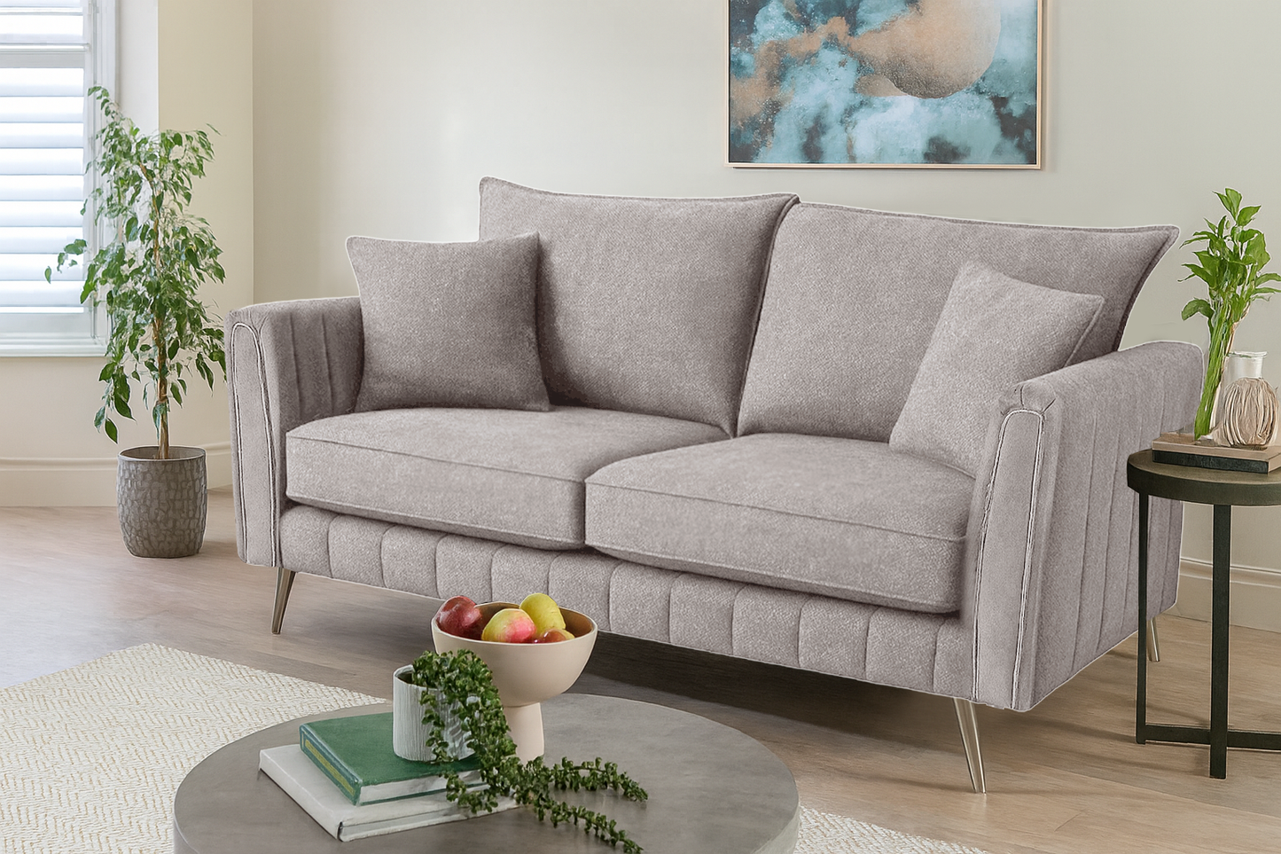 Gray sofa in a living room with decorative items and plants.