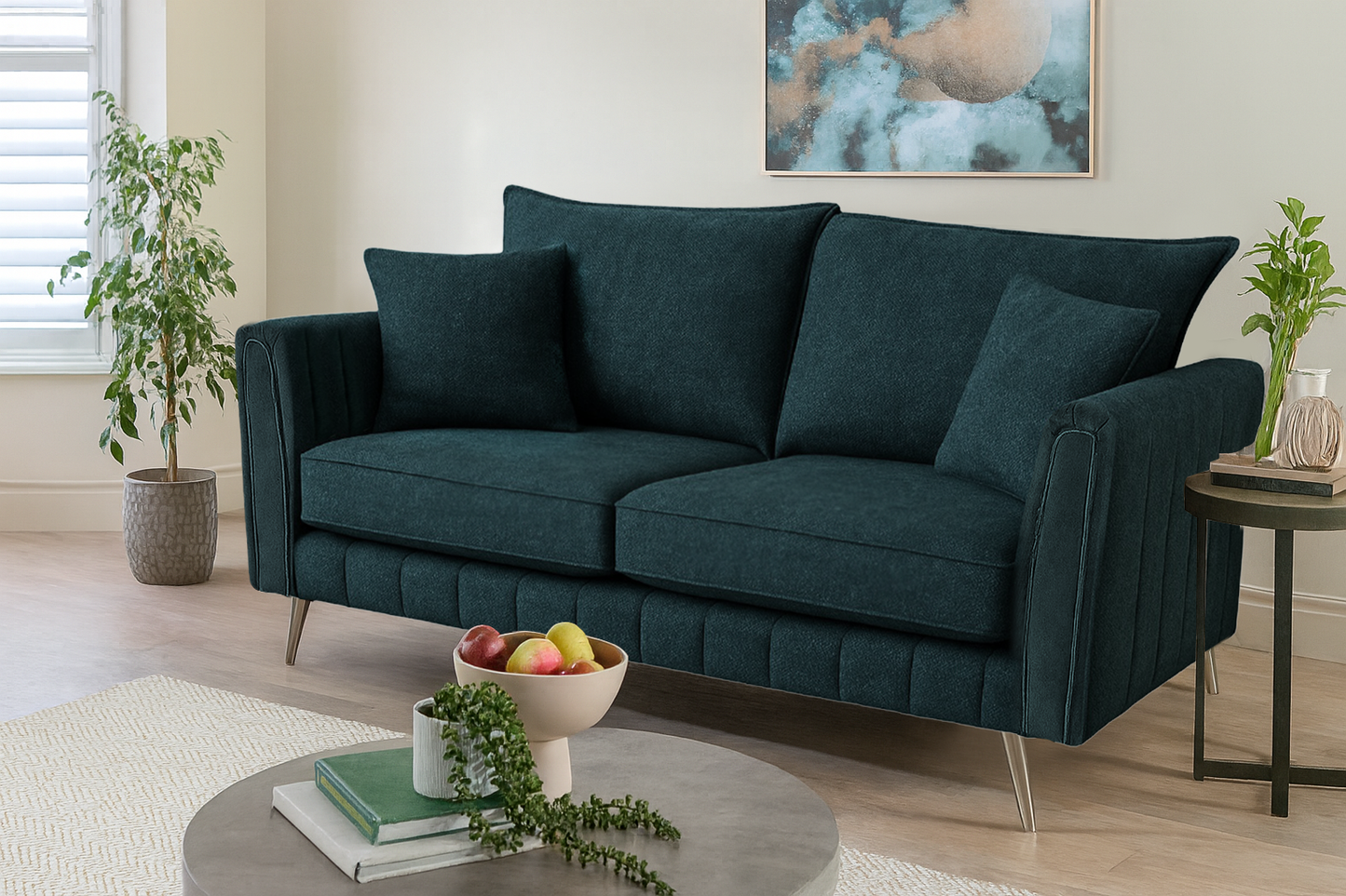 Teal sofa in a living room setting with decor elements.