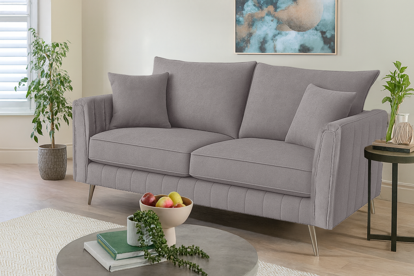 Gray sofa in a living room with decorative items and plants.