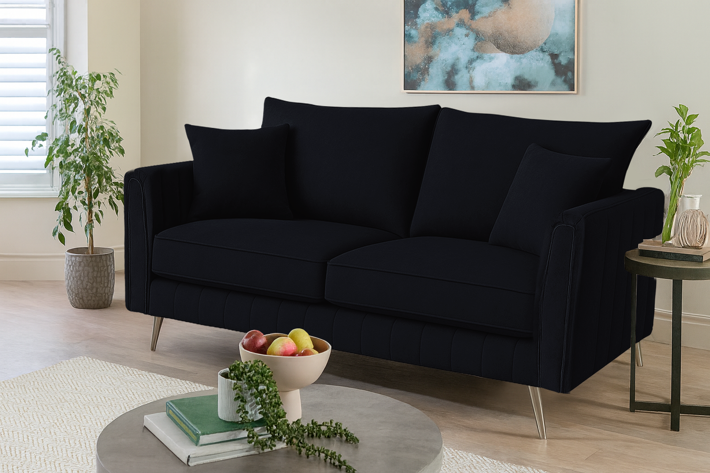Black sofa in a living room with decor elements.