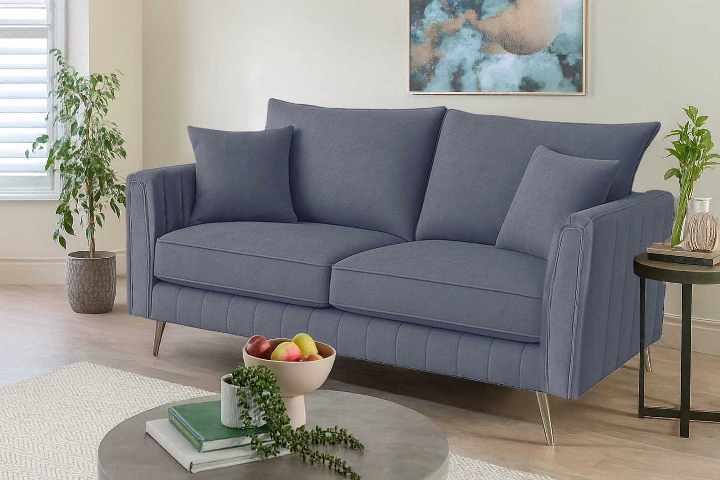 Gray sofa in a living room setting with decor elements.