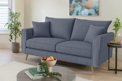 Gray sofa in a living room setting with decor elements.