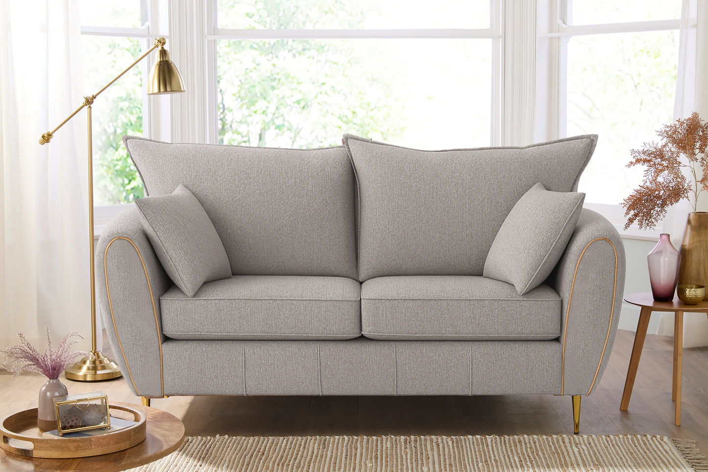 Gray sofa in a living room with decor elements