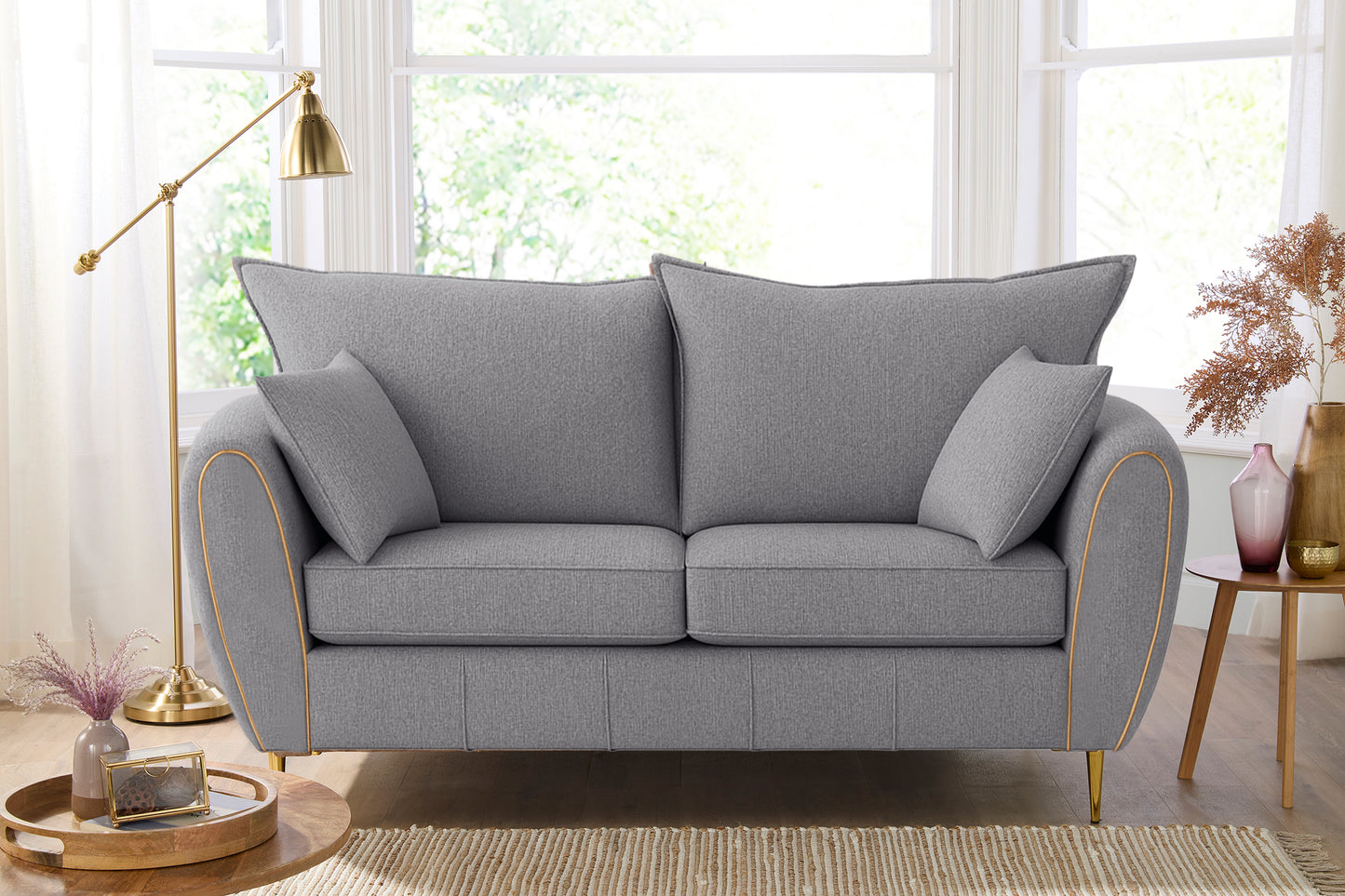 Gray sofa in a living room with decor elements.