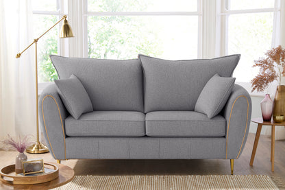 Gray sofa in a living room with decor elements.
