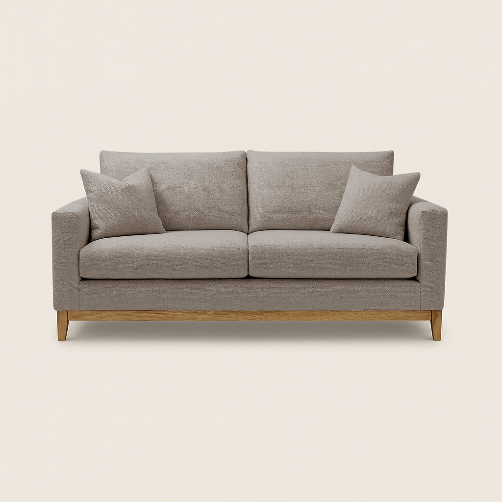 Gray sofa with wooden legs on a beige background