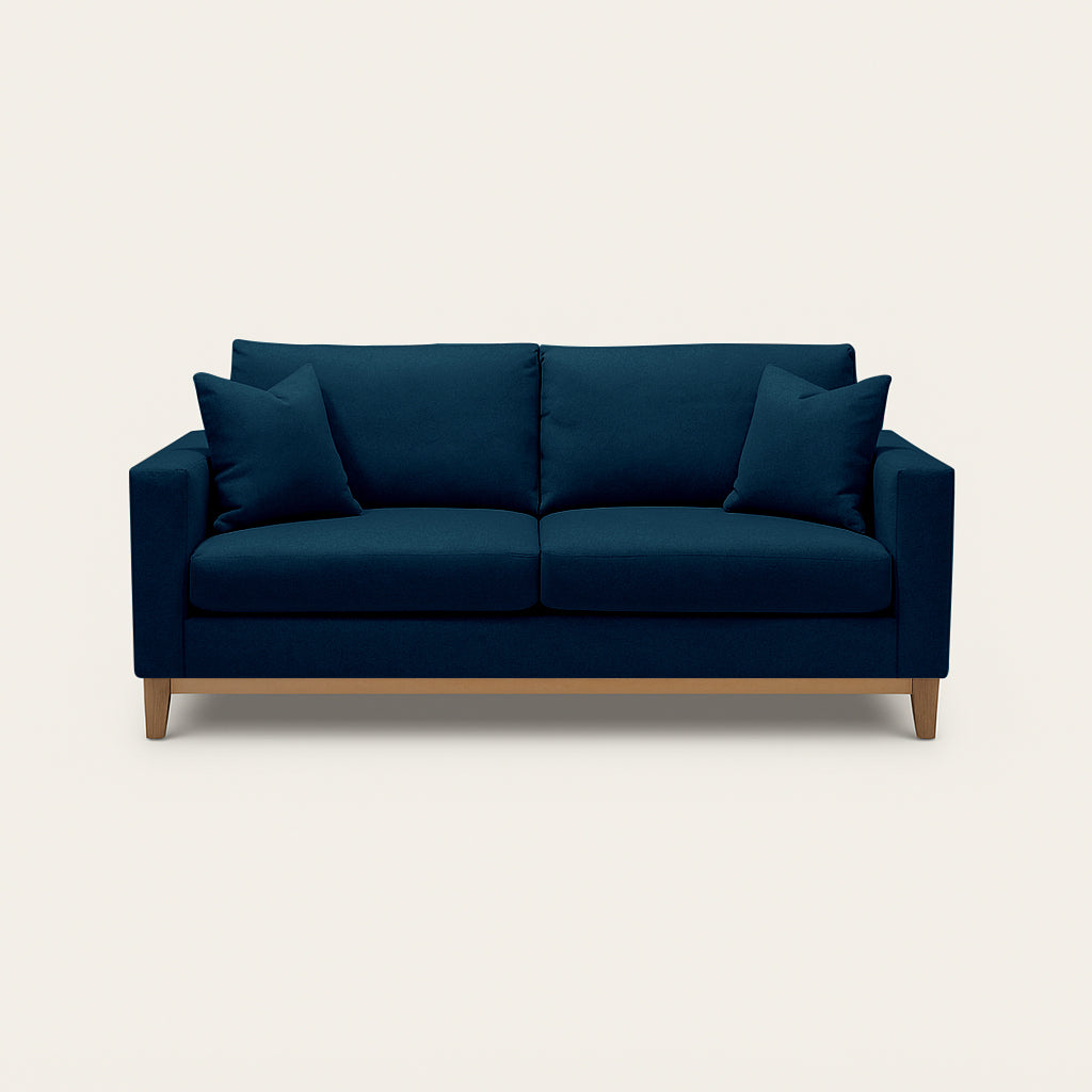 Blue sofa with wooden legs on a white background