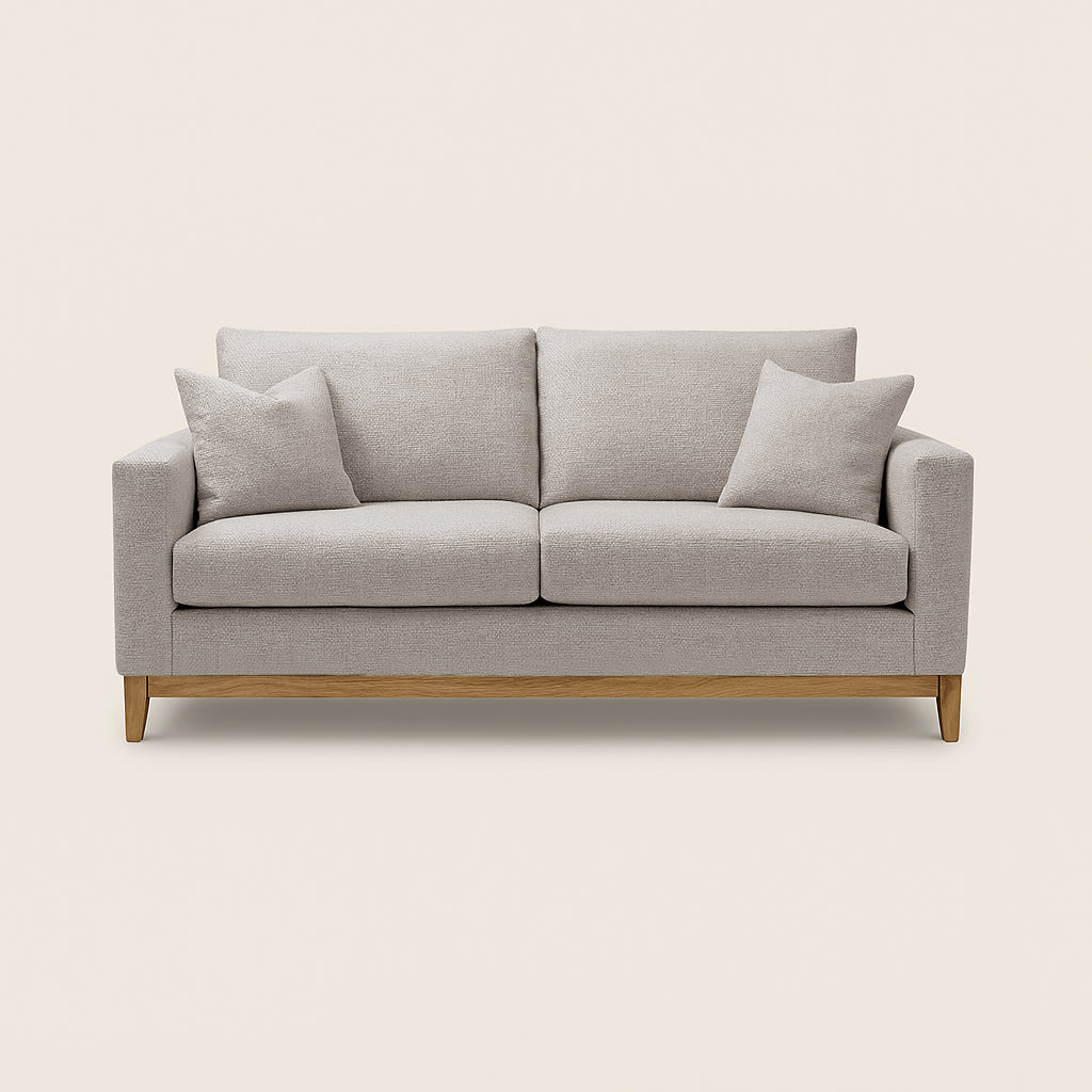 Gray sofa with wooden legs on a beige background