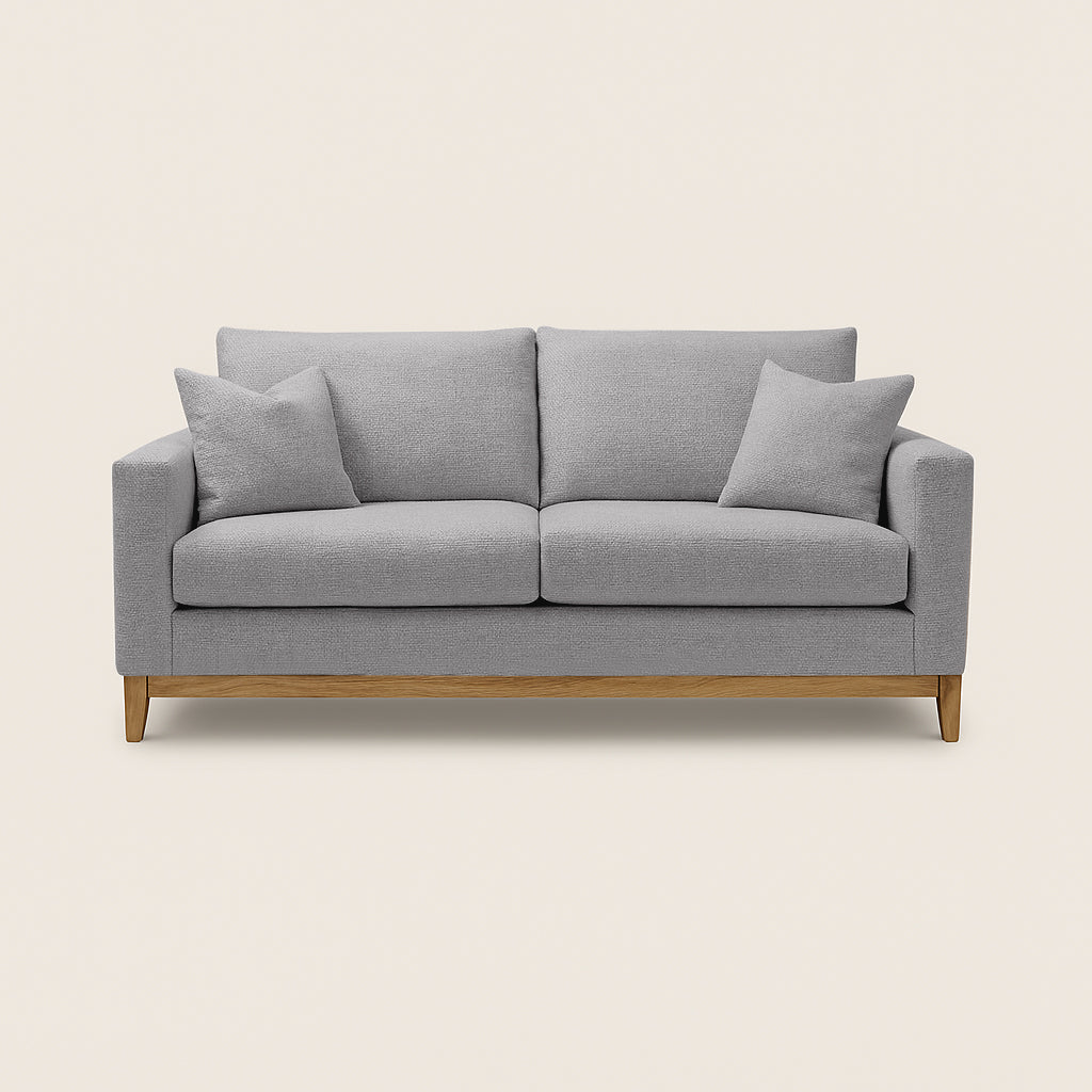 Gray sofa with wooden legs on a beige background