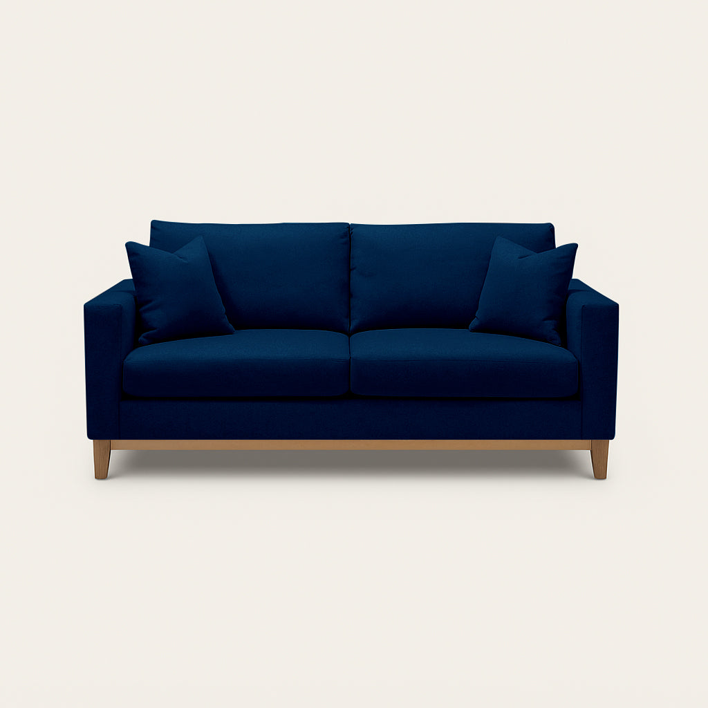 Blue sofa with wooden legs on a white background