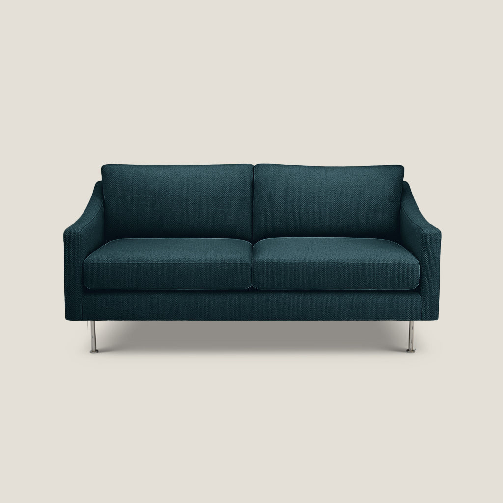 teal sofa on a light beige background