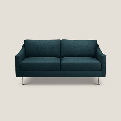 teal sofa on a light beige background