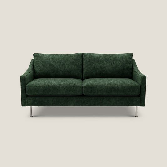 Green sofa on a light beige background